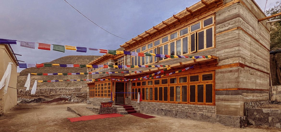 Sustainable earth: This two-story structure showcases the beauty of rammed earth construction, with horizontal layers of soil creating a textured, thermally efficient facade.